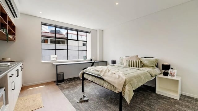 Bed desk and kitchen counter bedroom at UniLodge Auckland Central in Auckland Student Accommodation