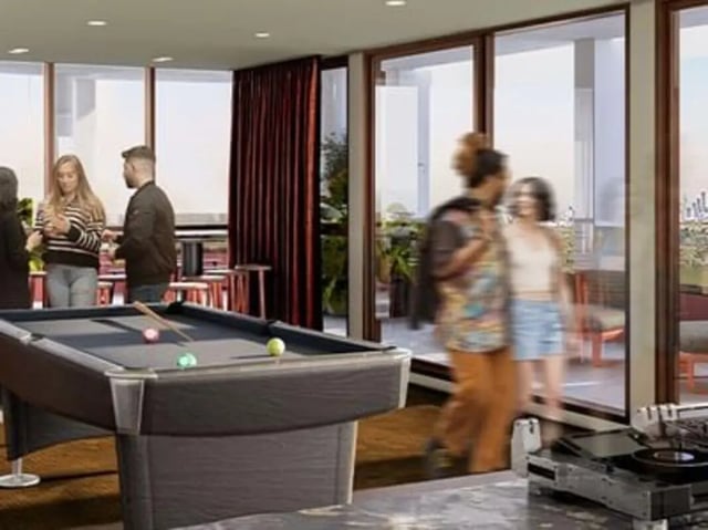 Pool table people red curtains game room at Caulfield Place in Melbourne Student Accommodation