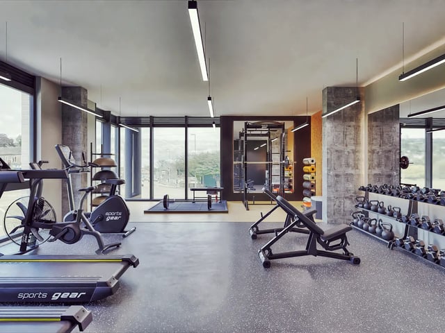 Treadmills bikes weights benches gym equipment interior at Beckton House in Nottingham Student Accommodation
