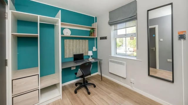 Wardrobe desk chair mirror and shelves bedroom at Emily Davies in Southampton Student Accommodation