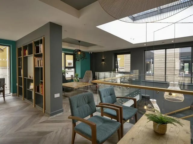 Bookshelf chairs and tables common area at Emily Davies in Southampton Student Accommodation