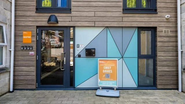 Building entrance with reception sign and sign exterior at Emily Davies in Southampton Student Accommodation