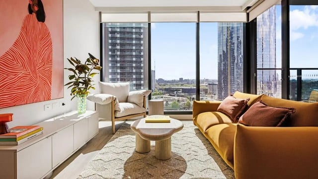 Modern living room with artwork sofa armchair living room at Indi South Bank in Melbourne Student Accommodation