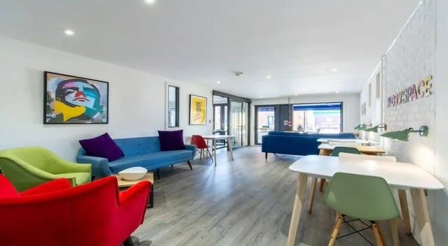 Colorful seating tables and artwork living room at St Giles Studios in Durham Student Accommodation