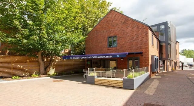 Student accommodation building with outdoor seating exterior at St Giles Studios in Durham Student Accommodation