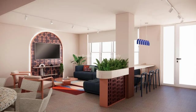 Sofa chairs coffee table and TV living room at Selly Oak Court in Birmingham Student Accommodation