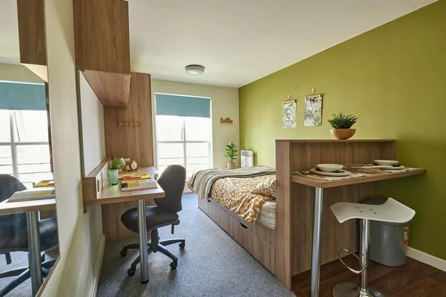 Bed desk chair bar stool dining area bedroom at Selly Oak Court in Birmingham Student Accommodation