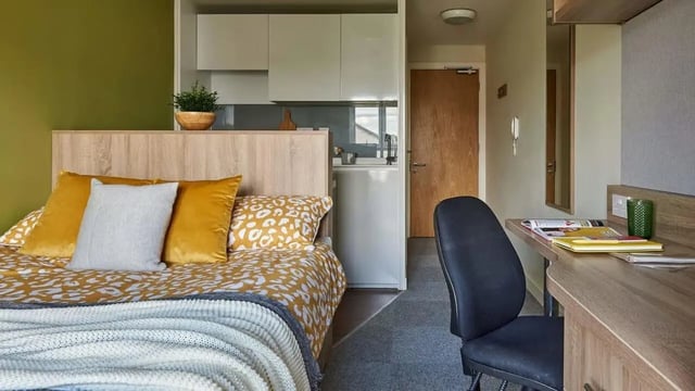 Bed desk and kitchenette student room at Selly Oak Court in Birmingham Student Accommodation