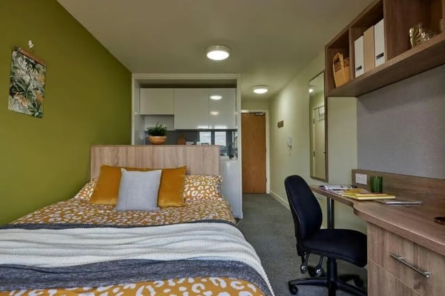 Bed desk and kitchenette student accommodation bedroom at Selly Oak Court in Birmingham Student Accommodation