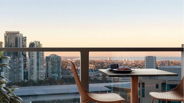 Table chairs coffee and croissant balcony view at West Tower, Melbourne Quarter in Melbourne Student Accommodation