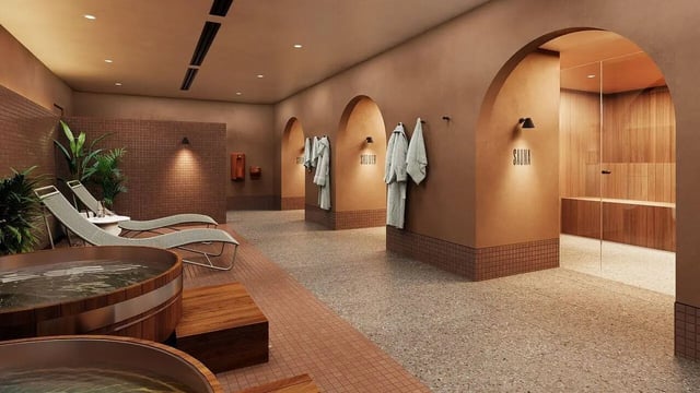 Wooden tubs lounge chairs plants sauna and showers spa area at WeAreLiving Preston in Melbourne Student Accommodation