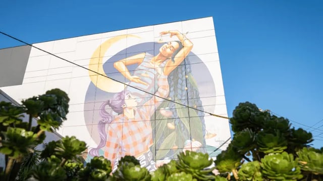 Mural with people moon and plants Exterior at WeAreLiving Preston in Melbourne Student Accommodation