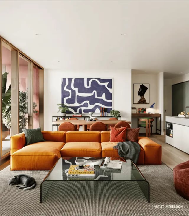 Orange sectional couch glass coffee table living room at Indi Footscray in Melbourne Student Accommodation