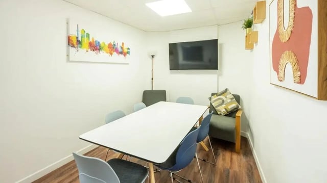 Table chairs TV artwork meeting room at Hollingbury House in Brighton Student Accommodation