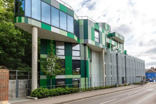 Modern building green facade glass windows exterior at Hollingbury House in Brighton Student Accommodation