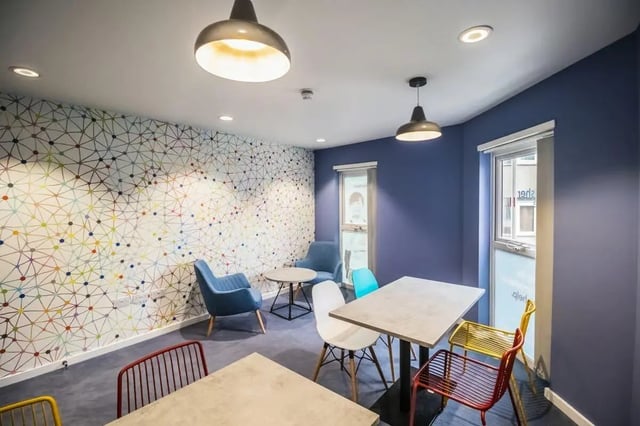 Colorful patterned wall tables and chairs communal area at Frobisher House in Plymouth Student Accommodation