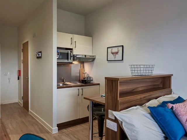 Kitchenette with bed and artwork studio apartment at Central Studios Reading in Reading Student Accommodation