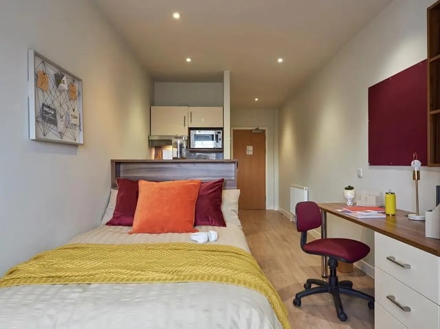 Bed desk kitchenette and bed at Central Studios Reading in Reading Student Accommodation