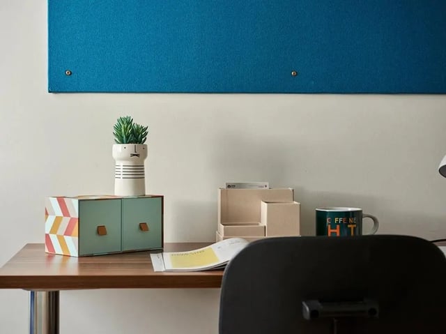 Desk with drawers plant mug and organizer study area at Central Studios Reading in Reading Student Accommodation