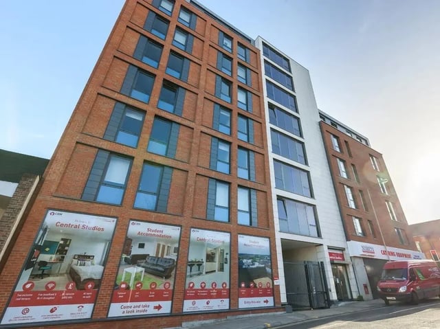 Modern brick building with advertised room details exterior at Central Studios Reading in Reading Student Accommodation