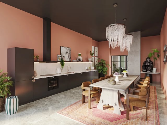 Kitchen dining area with long table and chairs at Biscuit Factory in Belfast Student Accommodation