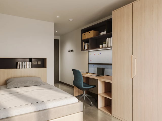 Bed desk chair shelves wardrobe bedroom at Biscuit Factory in Belfast Student Accommodation