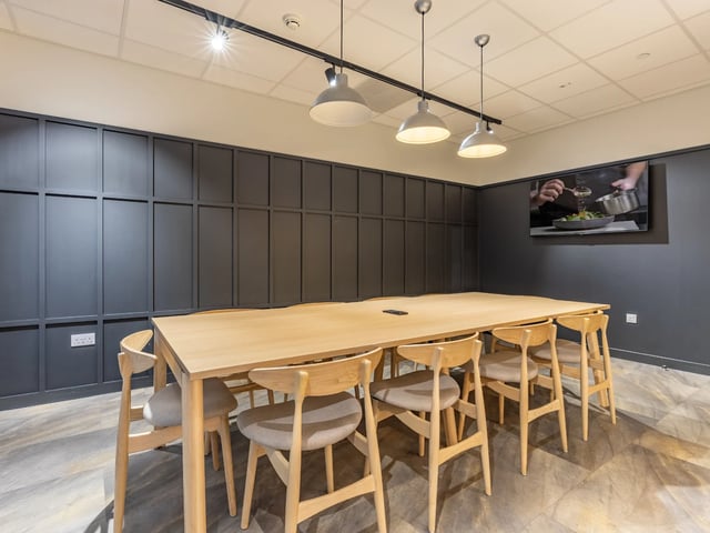 Large table chairs television common area at Stanley Studios - Dundee in Dundee Student Accommodation