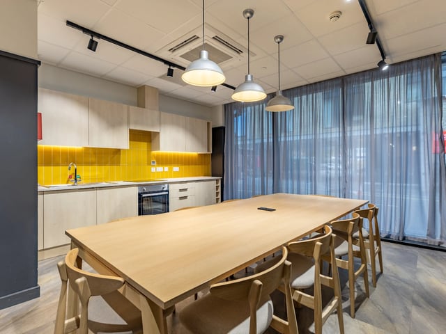 Modern kitchen with large dining table and chairs Kitchen at Stanley Studios - Dundee in Dundee Student Accommodation