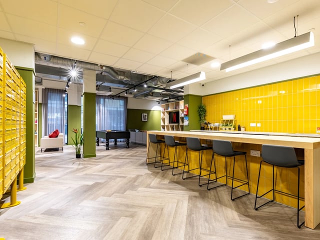 Yellow tiled wall bar with stools billiard table Common area at Stanley Studios - Dundee in Dundee Student Accommodation