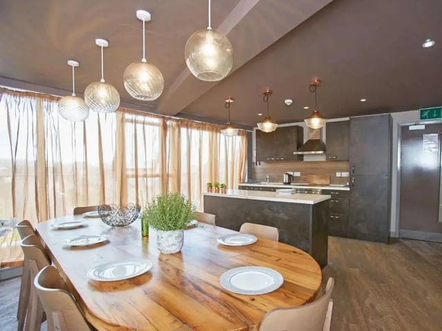 Wooden dining table with chairs kitchen area Image Type at Woodside House in Glasgow Student Accommodation