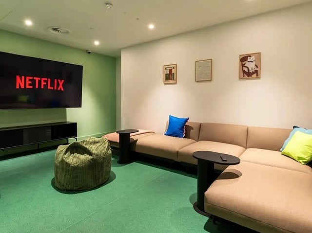 Netflix screen sofa beanbag tables artwork living room at Glassworks in Bristol Student Accommodation