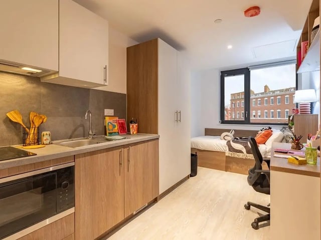 Kitchenette bed desk and wardrobe studio apartment at Glassworks in Bristol Student Accommodation