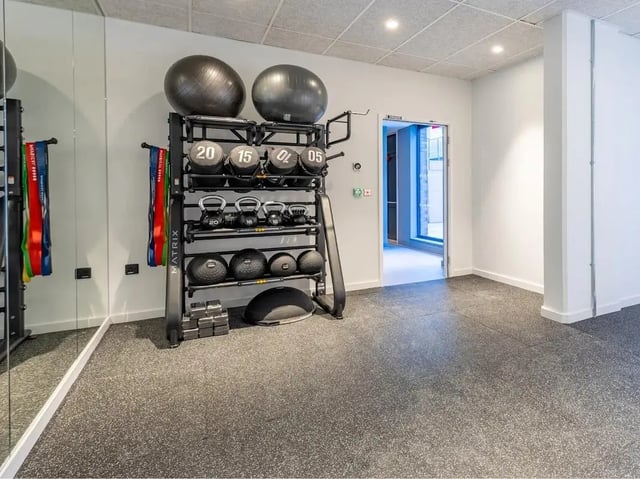 Gym equipment rack with balls and weights Image Type Gym at Glassworks in Bristol Student Accommodation