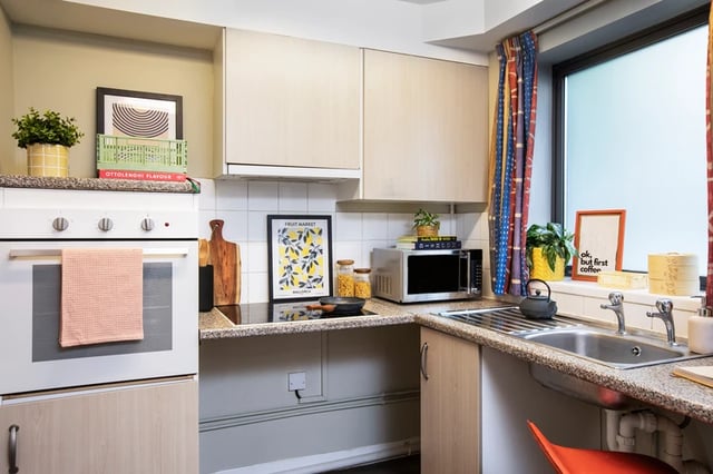 Oven microwave sink with kettle and artwork Kitchen at Purbeck House in Bournemouth Student Accommodation