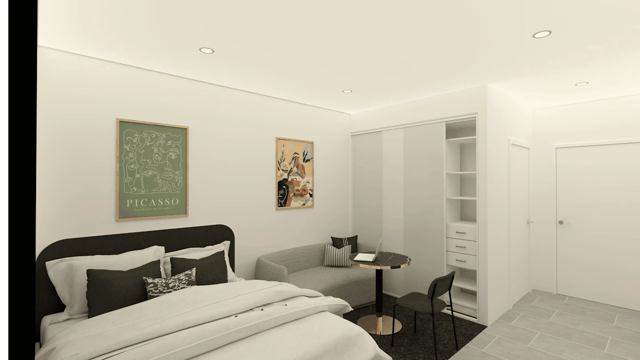 Bed sofa table wardrobe and door bedroom at UKO Rosebery in Sydney Student Accommodation
