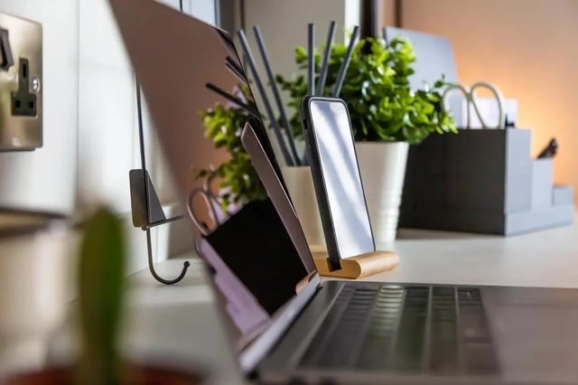 Laptop phone plant and desk accessories study area at 123 York Street in Belfast Student Accommodation