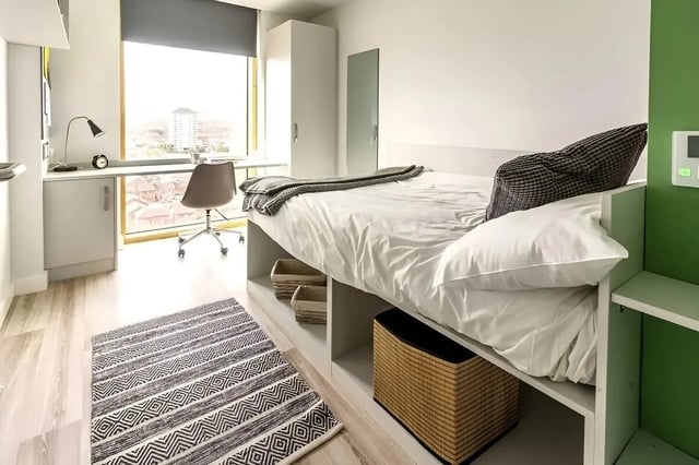 Bed desk chair rug storage baskets bedroom at 123 York Street in Belfast Student Accommodation
