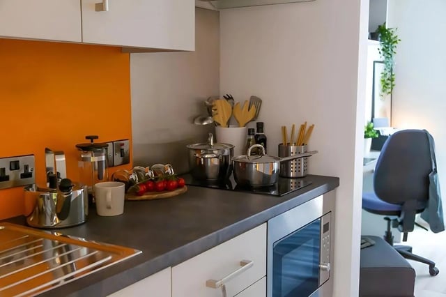Kitchenware and microwave kitchen area at 123 York Street in Belfast Student Accommodation