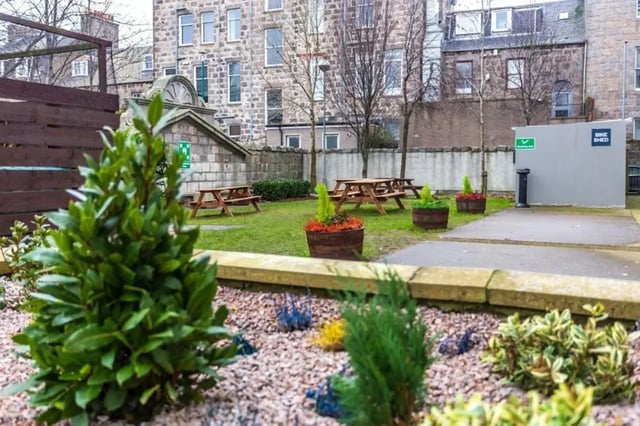 Picnic tables and bike shed exterior at Mealmarket Exchange in Aberdeen Student Accommodation
