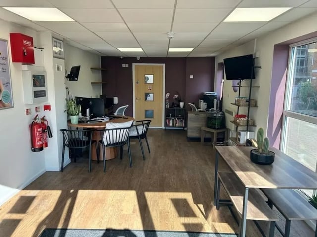 Reception desk computers fire extinguishers communal area interior at The Railyard in Liverpool Student Accommodation