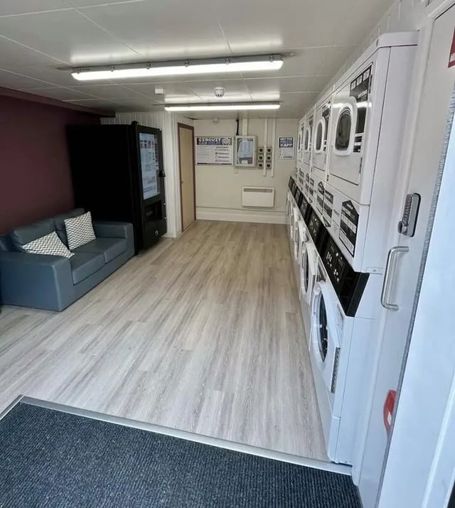 Laundry machines sofa and vending machine common area at The Railyard in Liverpool Student Accommodation