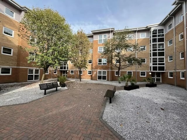 Courtyard with benches and trees exterior at The Railyard in Liverpool Student Accommodation