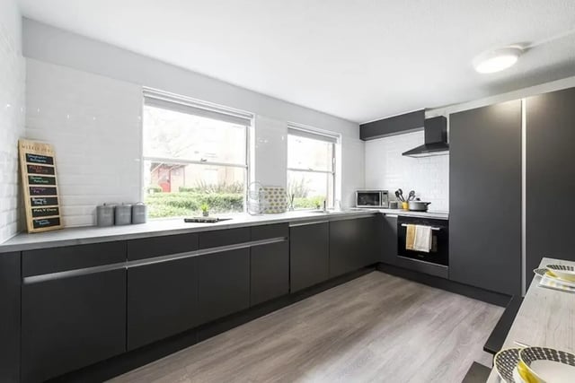 Modern kitchen with dark cabinets and white tiled backsplash kitchen at Regents Court in Leicester Student Accommodation