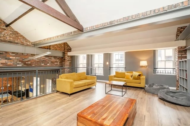 Yellow sofas coffee tables beanbags living room at Sheffield 3 in Sheffield Student Accommodation