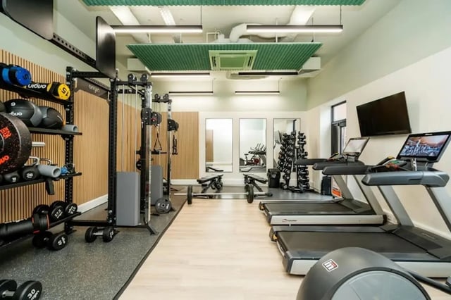 Weight racks treadmills mirrors and gym equipment gym at Sheffield 3 in Sheffield Student Accommodation