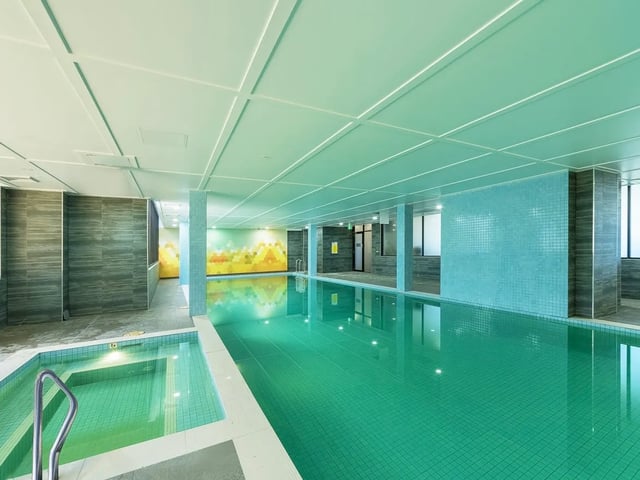 Indoor swimming pool with steps and mural Image Type swimming pool at Belong Waterloo in Sydney Student Accommodation