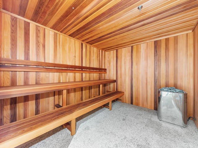 Wooden sauna benches and heater sauna at Belong Macquarie in Sydney Student Accommodation