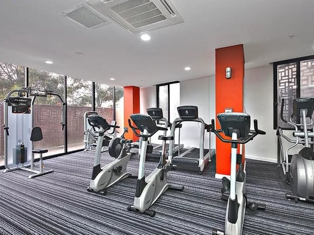 Gym equipment including treadmills and stationary bikes gym at Belong Zetland in Sydney Student Accommodation