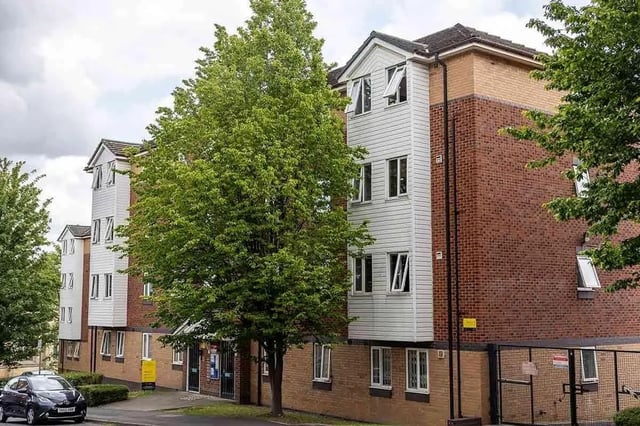 Brick and white building exterior with trees Exterior at Woodhouse Flats in Leeds Student Accommodation