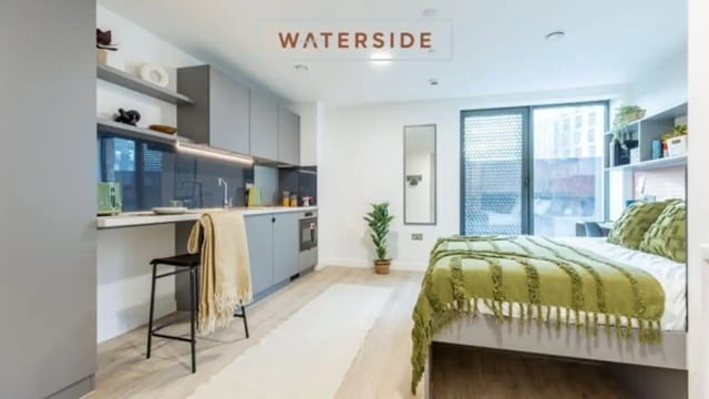 Studio apartment with kitchen bed and bar stool living room at Waterside in Bristol Student Accommodation